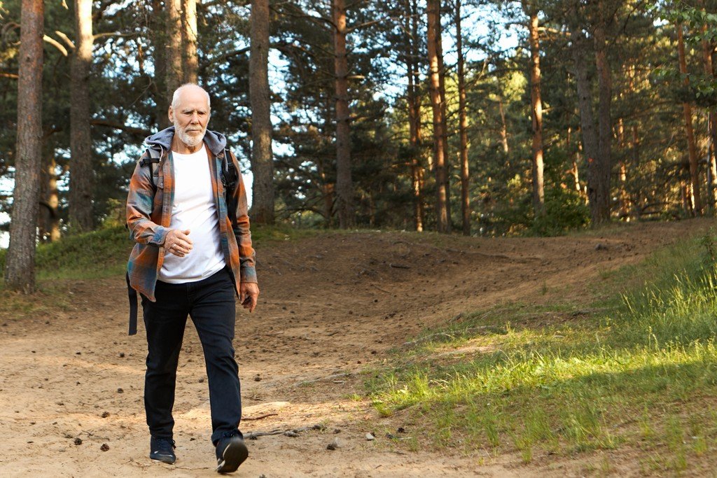 Cliff smiling outdoors after being fitted with high-quality hearing aids