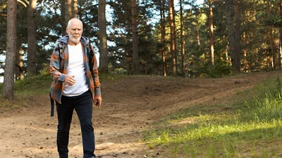 Cliff smiling outdoors after being fitted with high-quality hearing aids