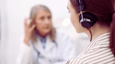 Audiologist consulting with a patient about their hearing health options